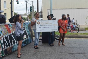 Holding their winning check at the Central City Fest