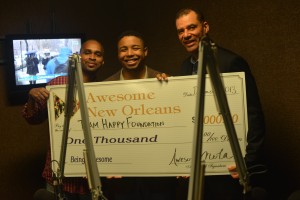 Happy Johnson accepts his award at WBOK 1230AM Morning Show with Oliver Thomas and producer Lee Hardy